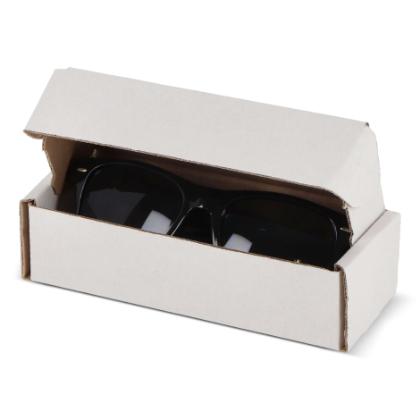Étui carton blanc contenant une paire de lunettes noires, vu en plongée