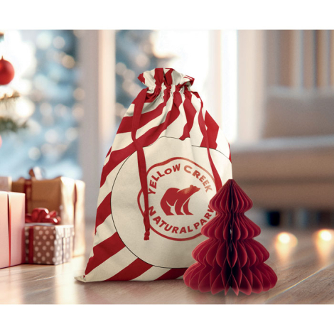 Sac coton à rayures rouges posé devant des cadeaux, marquage circulaire au centre