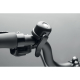 Sonnette de vélo noire en métal fixée sur le guidon d’un vélo en situation, sans marquage.