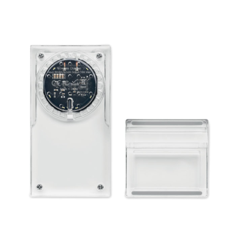 Chargeur sans fil transparent vu de dos avec socle démonté et surface électronique apparente, sans marquage.