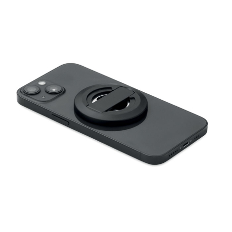 Support téléphone rond noir fixé à un smartphone posé à plat, sans personnalisation.