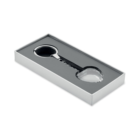 Porte-clés cœur en verre transparent présenté dans une boîte rectangulaire ouverte avec intérieur rembourré, sans marquage visib Porte-clés cœur en verre transparent présenté dans une boîte rectangulaire ouverte avec intérieur rembourré, sans marquage visib