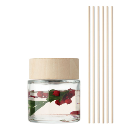 Flacon en verre transparent avec bouchon bois clair présenté à côté de six tiges de diffusion.