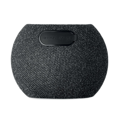Vue arrière de l’enceinte ronde noire montrant l’interrupteur et le port de charge.