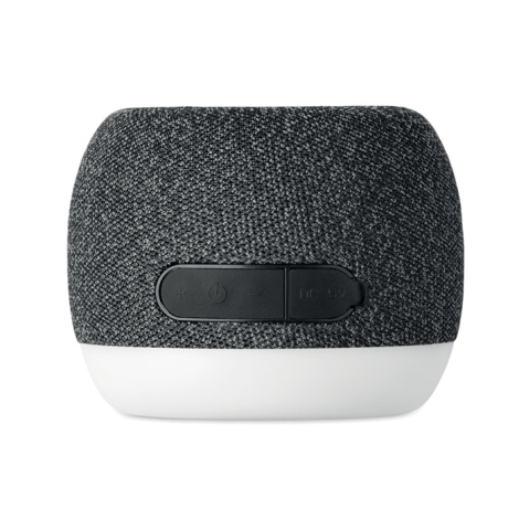 Vue arrière de l’enceinte ronde montrant les boutons de commande et le port de charge dans une bande noire.