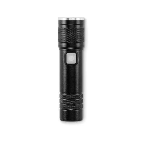 Lampe torche en aluminium noir vue de face avec bouton transparent au centre et lentille circulaire argentée.