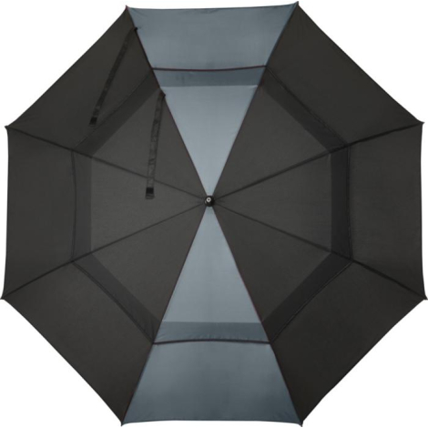 Parapluie de golf coupe-vent vu de dessus, toile noire avec structure interne apparente.