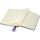 Carnet A5 ouvert montrant ses pages crème imprimées avec colonnes et rubans marque-pages.