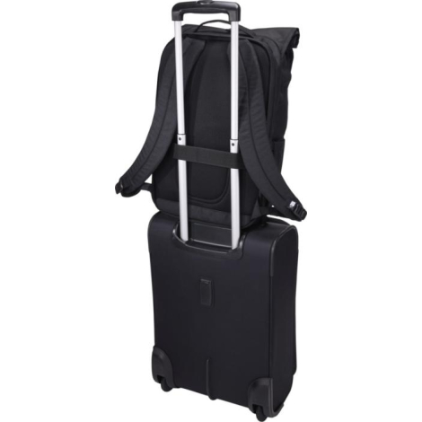 Vue arrière du sac fixé sur une valise via une sangle horizontale, sans marquage visible.