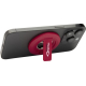 Support de téléphone rouge fixé à l’arrière d’un smartphone en position inclinée, marquage visible sur la patte rabattable.