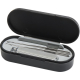 Coffret manucure noir de forme ovale ouvert contenant coupe-ongles, lime et pinces métalliques, sans personnalisation visible.