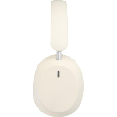 Casque beige clair de profil, oreillette droite en avant-plan avec ouverture visible sur la coque extérieure, sans personnalisat