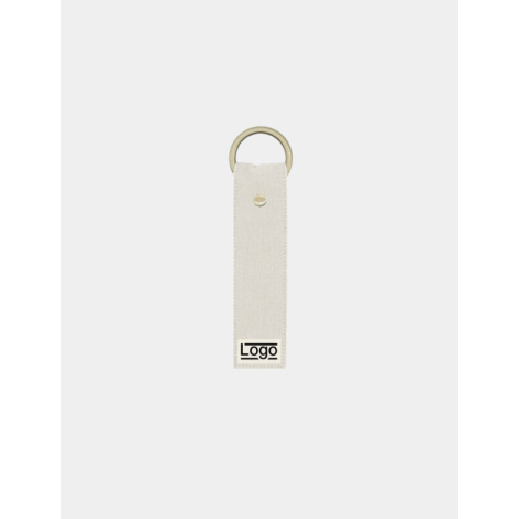 Porte-clés écru avec anneau doré et rivet central, marquage en bas