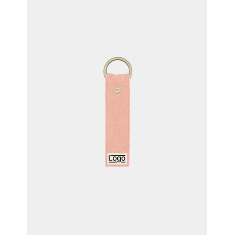 Porte-clés rose saumon avec anneau doré et rivet central, marquage en basv