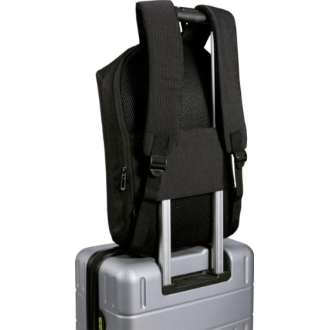 Vue arrière du sac à dos fixé sur la poignée télescopique d’une valise, montrant les bretelles rembourrées, le panneau dorsal en