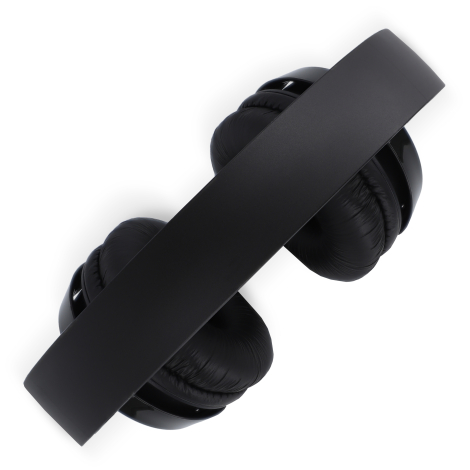 Casque Philips TAH4209 noir plié à plat, format compact pour rangement.