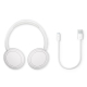 Casque Philips TAH5209 blanc à plat avec câble de recharge USB-C présenté à côté.