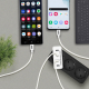 Chargeur blanc branché à multiprise relié à deux smartphones avec marquage latéral Chargeur blanc branché à multiprise relié à deux smartphones avec marquage latéral