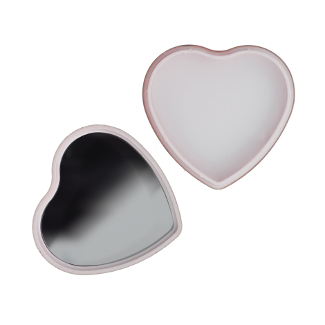 Boîtier cœur ouvert montrant un miroir interne et un compartiment vide, sans personnalisation visible sur cette version.