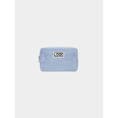 Trousse rectangulaire souple de couleur bleu clair, photographiée de face sur fond neutre, fermeture zippée visible sur le côté 