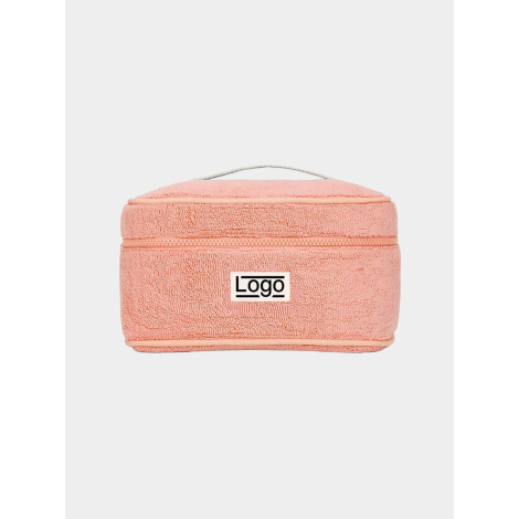 Vanity rectangulaire souple rose corail, photographié de face sur fond neutre, avec poignée supérieure et fermeture zippée horiz