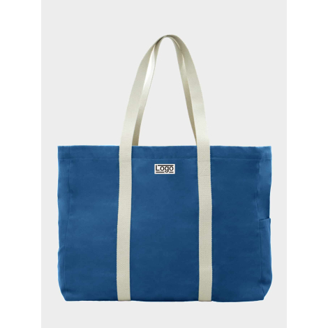 Sac de plage bleu roi vu de face avec étiquette et marquage visible