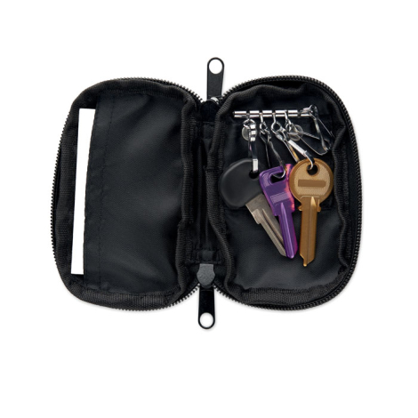 Trousse à clés ouverte présentée à plat, montrant l’intérieur avec barre métallique équipée de plusieurs anneaux porte-clés et u