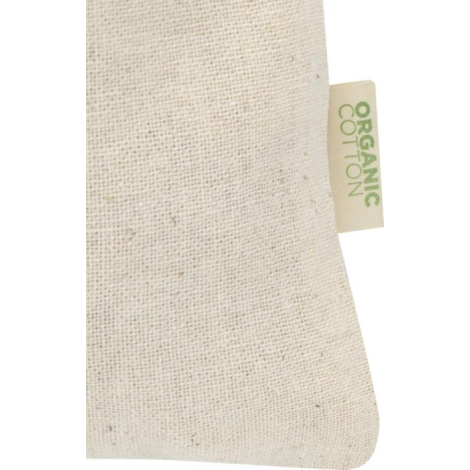 Gros plan sur la matière du sac écru mettant en évidence le tissage du coton et une étiquette textile latérale, sans marquage vi