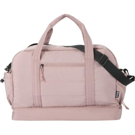 Sac de voyage matelassé rose présenté de face avec poche frontale zippée, sans marquage visible.