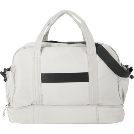 Vue arrière d’un sac de voyage beige montrant les poignées et une bande horizontale, sans marquage visible.