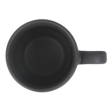Vue de dessus d’un mug en grès avec intérieur sombre et anse à droite, sans marquage visible.