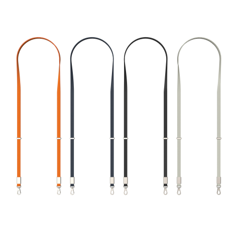 Quatre lanières de différentes couleurs alignées avec attaches métalliques visibles, sur fond clair, sans marquage apparent