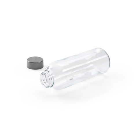 Bouteille en verre transparente couchée avec bouchon séparé à proximité montrant l’ouverture du col, sans marquage visible.