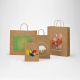 Ensemble de sacs en papier kraft marron avec différents marquages visibles sur la face avant.