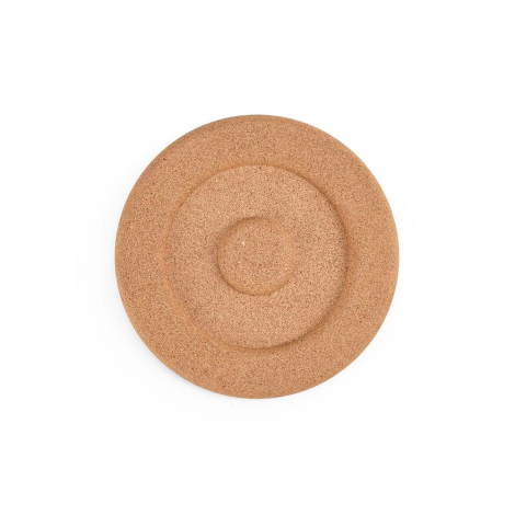 Vue de dessus d’un dessous de plat en liège avec anneaux concentriques, sans marquage visible.