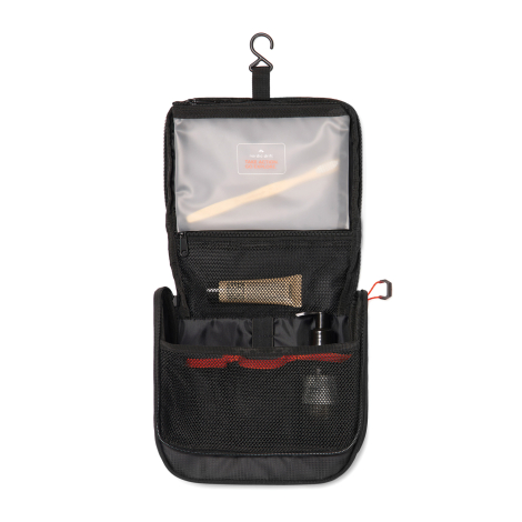 Trousse ouverte suspendue montrant les compartiments internes, sans marquage visible.