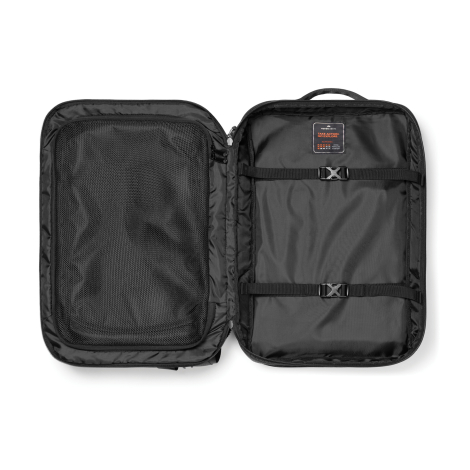 Sac à dos ouvert à plat montrant les compartiments internes, sans marquage visible.