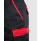 Zoom sur la poche latérale et les détails contrastés rouges d’un short de travail noir sans marquage visible. Zoom sur la poche latérale et les détails contrastés rouges d’un short de travail noir sans marquage visible.
