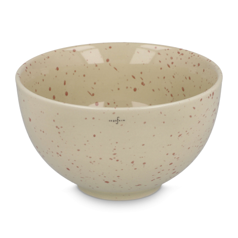 Bol en céramique beige mouchetée présenté seul, sans marquage apparent.