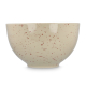 Bol en céramique beige mouchetée présenté de profil, sans marquage apparent. Bol en céramique beige mouchetée présenté de profil, sans marquage apparent.