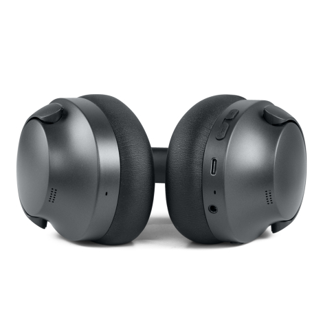 Détail des oreillettes du casque Bluetooth noir avec boutons et connectiques visibles, sans marquage apparent.