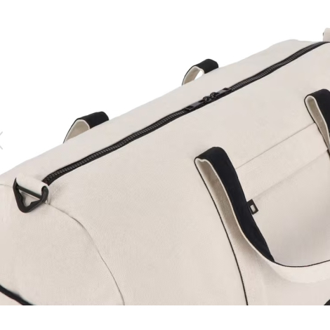 Dessus du sac de voyage beige avec fermeture zippée noire et poignées renforcées visibles, sans personnalisation visible.