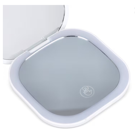 Miroir compact ouvert avec éclairage LED allumé autour du miroir inférieur, sans personnalisation visible.