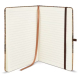 Carnet ouvert dévoilant des pages lignées crème, un ruban marque-page et une fermeture élastique assortie. Carnet ouvert dévoilant des pages lignées crème, un ruban marque-page et une fermeture élastique assortie.