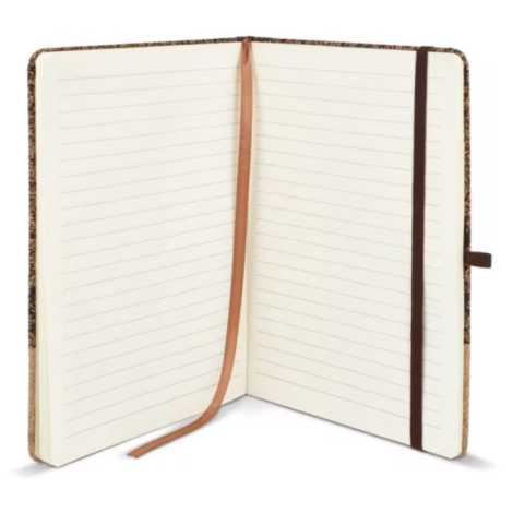 Carnet ouvert dévoilant des pages lignées crème, un ruban marque-page et une fermeture élastique assortie.