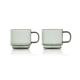 Deux tasses expresso en verre fumé avec anse présentées côte à côte de face, sans marquage visible sur les faces présentées.