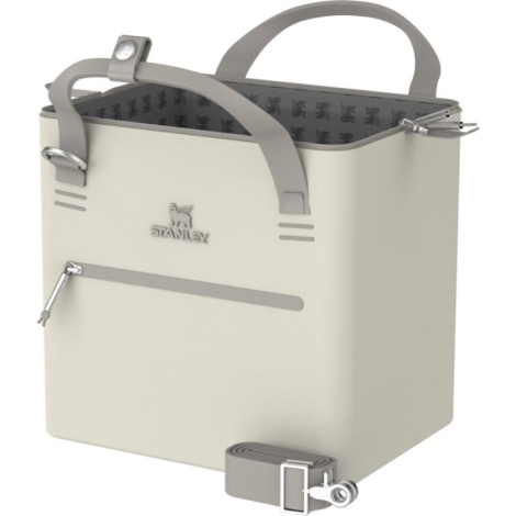 Mini-sac isotherme crème présenté ouvert, laissant apparaître sa doublure intérieure à motif et sa fermeture zippée supérieure.