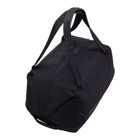 Vue de trois quarts arrière du sac de voyage mettant en évidence sa forme et ses poignées, sans personnalisation visible.