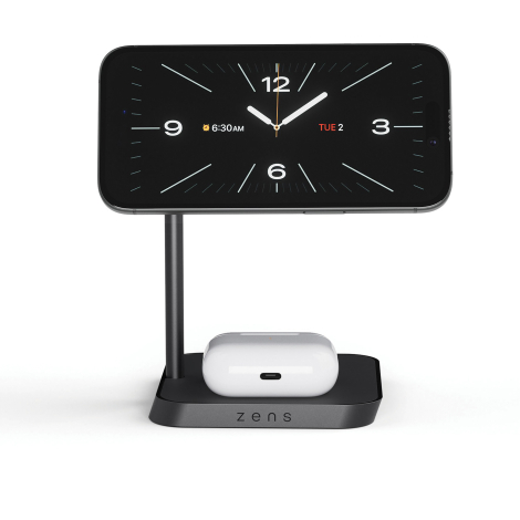 Chargeur de bureau utilisé avec un smartphone fixé sur le support magnétique en position horizontale et des écouteurs sans fil p