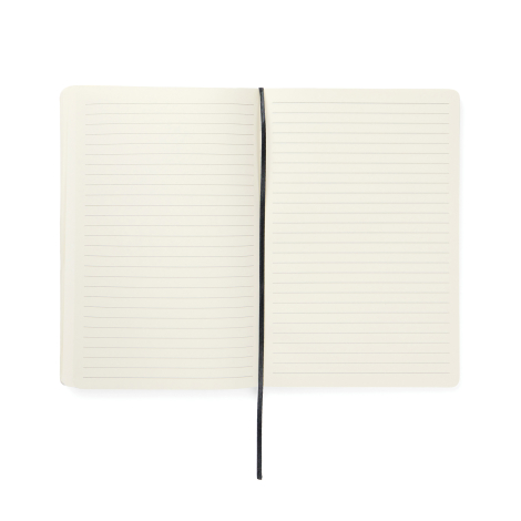 Carnet de notes ouvert présentant deux pages crème lignées et un ruban marque-page noir placé au centre.